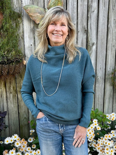 Embrace cozy elegance with this long sleeve cowl neck knit sweater in a stunning lagoon hue. Its soft, breathable fabric offers all-day comfort, perfect for casual outings or relaxing at home. The graceful cowl neck adds a touch of sophistication, making it a versatile staple.

Material: 55% Rayon / 40% Polyester / 5% Spandex

Care Instructions: Hand wash cold, hang to dry