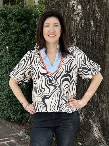 Fall in love with our Puff Sleeve Print Top! The unique contrasting V-neck and lovely black design on a beige background make this top effortlessly chic. The short puff sleeves add a touch of elegance to any outfit. Experience the perfect combination of style and comfort!

Material: 85% Rayon / 15% Nylon

Care Instructions: Gentle cool hand wash, dry flat