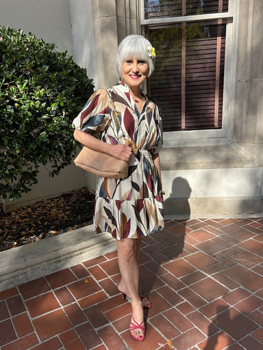 This Puff Sleeve Tiered Short Dress features a flattering cinched waist and charming puffed sleeves that add volume and elegance. Its lined fabric ensures comfort, while the V-neck with a placket collar offers a polished look. Perfect for fall, it showcases a gorgeous seasonal print that complements any wardrobe with ease. Ideal for gatherings or casual outings.

Barbara is wearing a size Small.

Material: 80% Rayon / 20% Nylon

Care Instructions: Gentle cool hand wash, dry flat