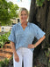 Enhance your wardrobe with our Textured Ruffle Top featuring a flattering V-neckline.. The gorgeous light blue hue and puffed sleeves add a touch of romance. The textured fabric provides dimension, and is perfect for both casual outings and dressier occasions.

Coleen is wearing a size small.

Material: 100% Polyester

Care Instructions: Hand wash cold, hang to dry