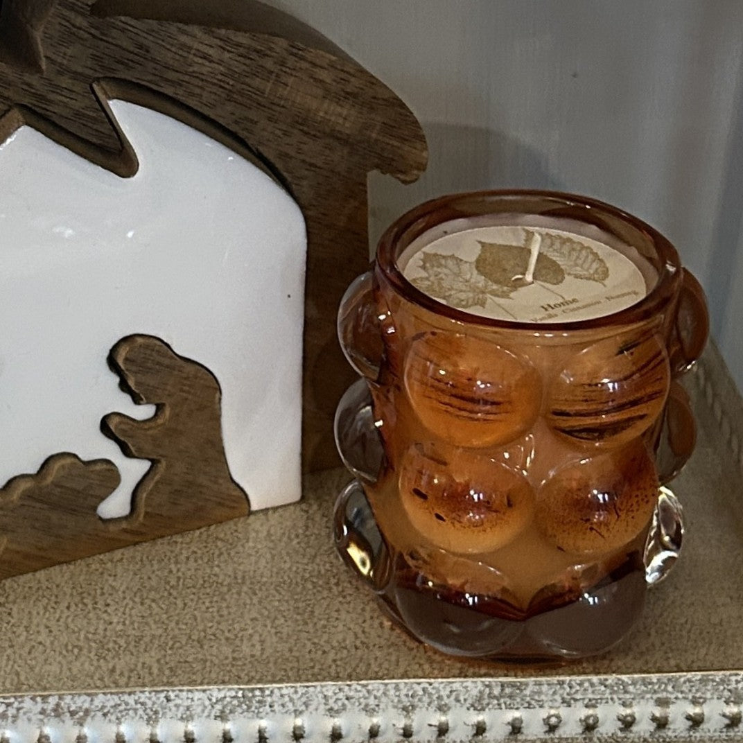 Discover the perfect blend of elegance and ambiance with our Hobnail Bubble Glass Candles. Each piece features a distinctive textured bubble container that catches the light beautifully, making it as much a decorative accent as it is a source of soothing fragrance. Hand-poured with lovely scents designed to calm and inspire, these candles transform any room into a sanctuary. Whether you're treating yourself or searching for a thoughtful gift, this unique combination of artful design and luxurious fragrance 