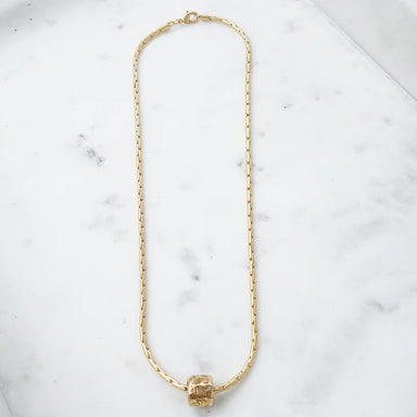 Enhance your everyday look with this beautiful Interlinking Chain Necklace with a stylish hammered tube charm. Delicate and elegant, this necklace will add a touch of sophistication to any outfit. Feel confident and inspired wearing this stunning accessory!  18” Chain 