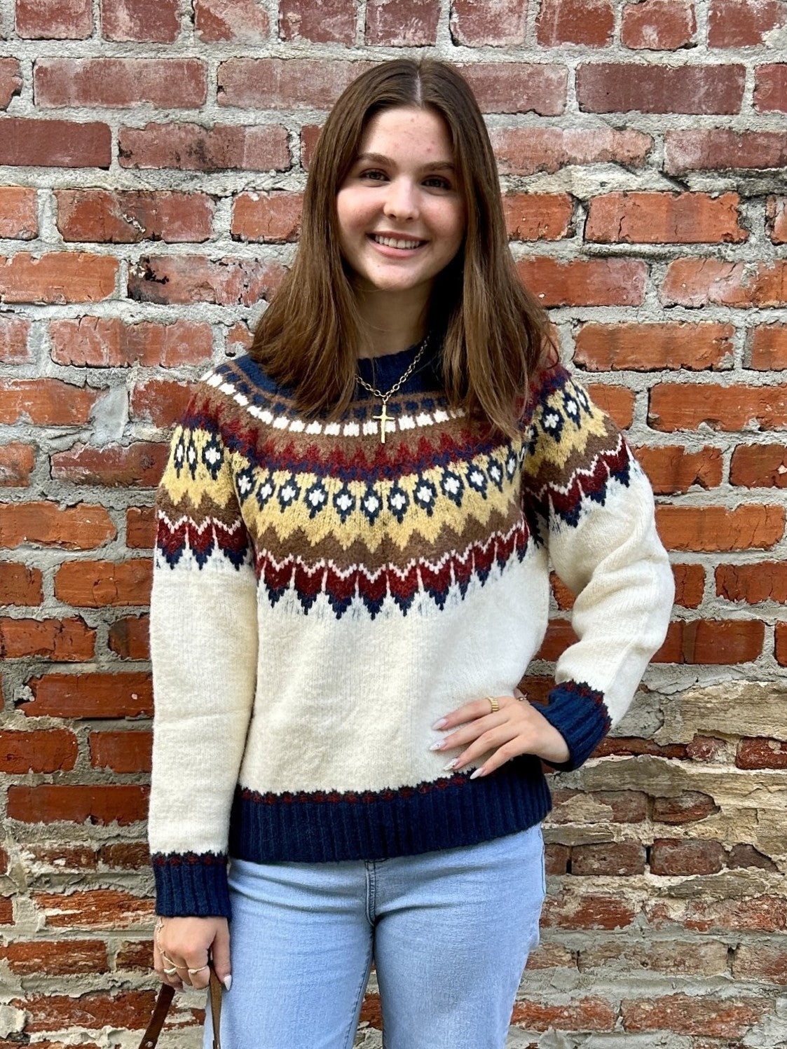 A timeless knit sweater perfect for cooler weather. This piece features a classic cream base with vibrant traditional Fair Isle patterning accent, blending warm fall color accents for an effortlessly polished look. The cozy construction makes it ideal for layering or wearing standalone. A versatile wardrobe essential!

Material: 60% Acrylic / 19% Polyester / 19% Nylon / 2% Spandex

Care Instructions: Hand wash with cold water, line dry