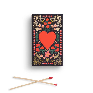 Juliet Matches, a charming box of 60 safety matches adorned with delicate hearts and floral designs. Perfect for lighting candles, fireplaces, or creating cozy ambiance in any room. Whether you're treating yourself or gifting to someone special, these beautifully decorated matches combine everyday utility with thoughtful style.&nbsp;

Details:

White board with soft touch lamination
Printed in full color
Strike only on box
4" L
60 matches