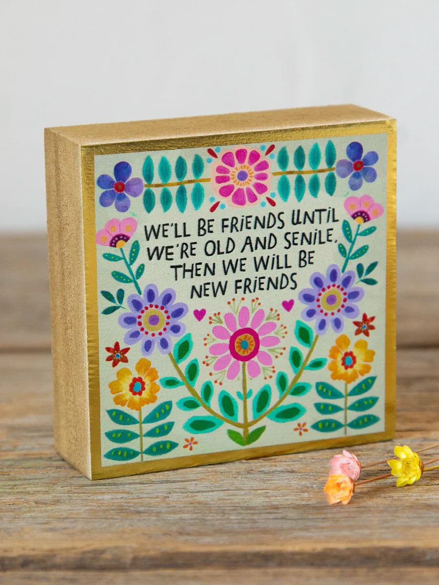 A charming wooden keepsake box that celebrates the moments and connections that matter most. This petite sign fits perfectly on shelves, desks, dressers, or anywhere you want a daily reminder of friendship and meaningful bonds. Crafted from real wood and designed to be lightweight, it's an ideal gift for someone special or a treasured addition to your own space. Small in size but big on sentiment.

Dimensions: 3in L x 3in W

Material &amp; Care: Wood