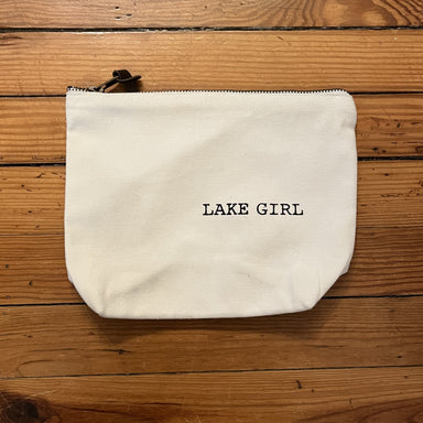 Bring your cosmetics and accessories in style with this Cotton Cosmetic Bag! Crafted with a cream colored background and a zipper closure, this bag will keep your items safe and secure. A stylish leather tassel adds a luxurious finishing touch.   Approximate Measurements: 9" x 7"