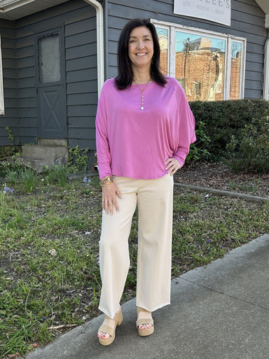 <p>Add effortless elegance to any outfit with our Lightweight Batwing Top. The beautiful, flowing design is perfect for any occasion. Choose from various stunning color options and enjoy the comfort of long sleeves with cuffed wrists and a flattering boatneck.&nbsp;</p> <p><span style="font-weight: 400;">One size fits most.</span></p> <p>Material<span style="font-weight: 400;">: 50% Cotton / 50% Polyester</span></p> <p><span style="font-weight: 400;">Care Instructions: Machine wash cold, hang dry</span></p>