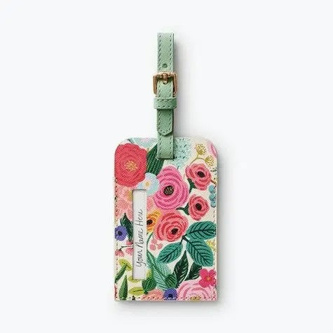 Travel with style and confidence using this beautifully designed luggage tag. The elegant Rifle Paper aesthetic makes your bag instantly recognizable on the carousel. A protective window displays only your name, keeping your full contact details private and secure. The interior card provides ample space for your complete information, ensuring you can be reached if your luggage goes astray. Durable construction withstands the rigors of frequent travel while adding a touch of sophistication to your journey.

