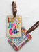 Travel in style with our Travel Happy Luggage Tags—the perfect blend of function and flair. Crafted with a vegan leather strap and durable buckle, these tags keep your luggage instantly recognizable while adding a touch of personality to your journey. Lightweight, eco-conscious, and designed to withstand the rigors of adventure, they're the accessory every traveler needs.

Dimensions: 5.25in L x 3.25in H

Material: Vegan leather