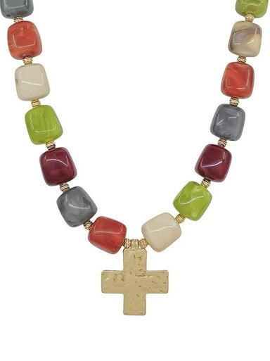 Radiant multi-color resin beads in warm jewel tones create instant visual impact on this 16 mm beaded necklace. A textured cross charm anchors the design with spiritual significance and refined elegance. This versatile necklace adds depth and personality to your everyday look.&nbsp;

Length: 18"