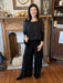 Step into the holiday season in style with our Madelyn Silky Pants. The lightweight silk fabric and lined interior combine with a banded, stretch waist and elegant flowy legs for a relaxed-yet-polished look. They can be perfectly paired with any of our Cobblestone tops. Additionally, these black pants will coordinate well with so many tops!  Details:  One size fits most 70% Viscose / 30% Seta (made from silk) Hand wash, lay flat or hang to dry Made in Italy