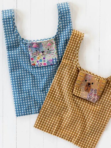 Adorable and functional, this market tote transforms from a charming critter-shaped pouch into a spacious, high-capacity bag. The clever design folds compactly for easy storage and travel, then expands to accommodate groceries, farmers market finds, and everyday shopping. Perfect for animal lovers who appreciate both style and practicality, it's a delightful gift that combines whimsy with everyday utility.

Measurements

Folded: 4.5in L x 4in H x .5in W
Unfolded: 11in L x 12in H, 5in gusset
6in handle drop

