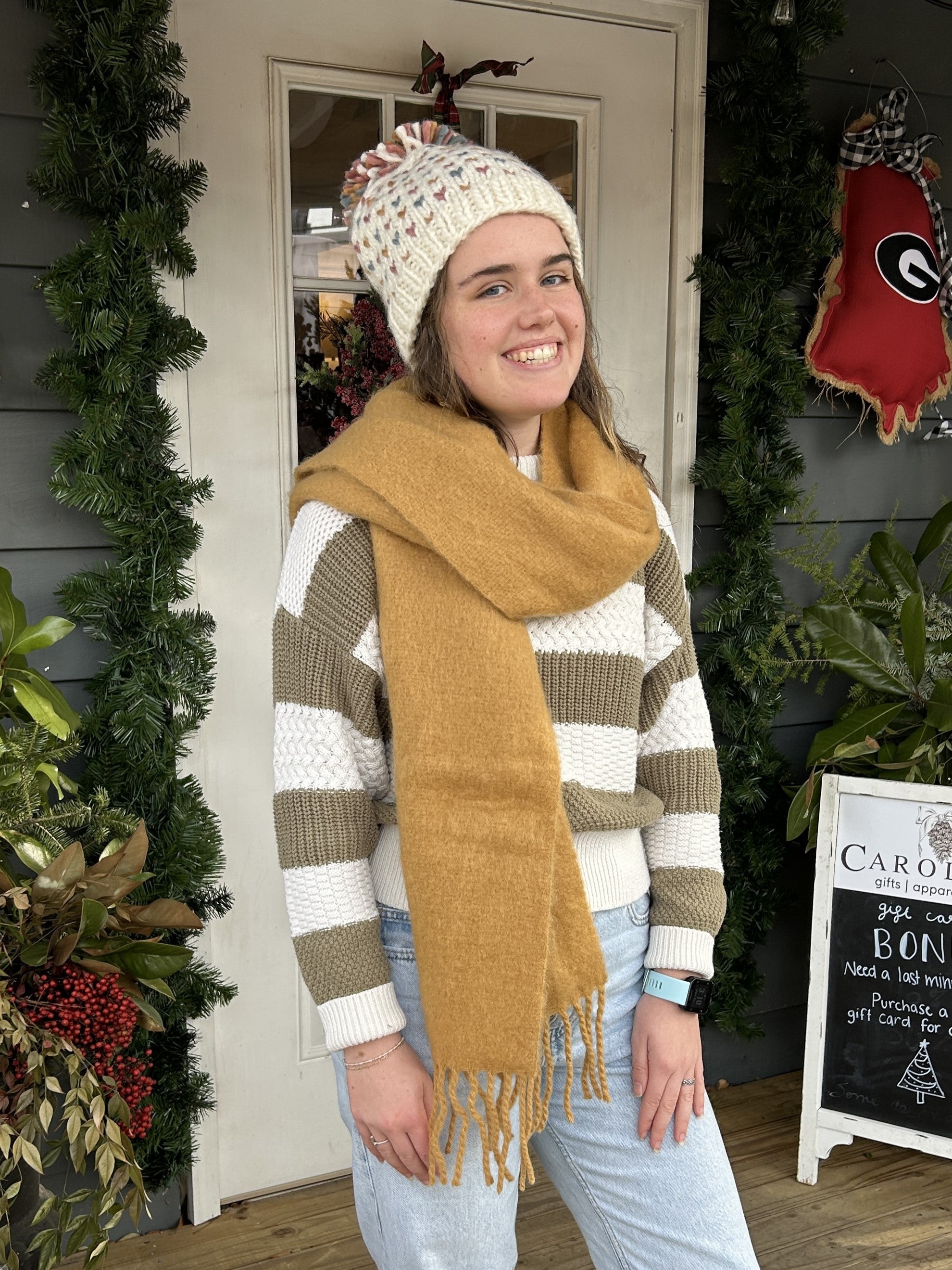 Stay warm and stylish on all your outdoor adventures with our Mini Heart Pompom Beanie! This winter hat features a cream background color with adorable sage and camel hearts, and is lined for extra warmth and comfort. Say goodbye to boring winter accessories and hello to fun and functional fashion!  Material: 100% Acrylic