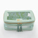 Keep your mahjong tiles organized in style with this thoughtfully designed storage bag. The structured silhouette maintains its shape for easy stacking and storage, while a zip-around closure keeps tiles secure. A clear panel lets you view your collection at a glance, and the built-in label window helps you identify sets instantly—perfect for collectors with multiple bags. Inside, a patterned lining adds personality, while coordinating tassel zipper pulls and a back handle make transport effortless. Fresh, 