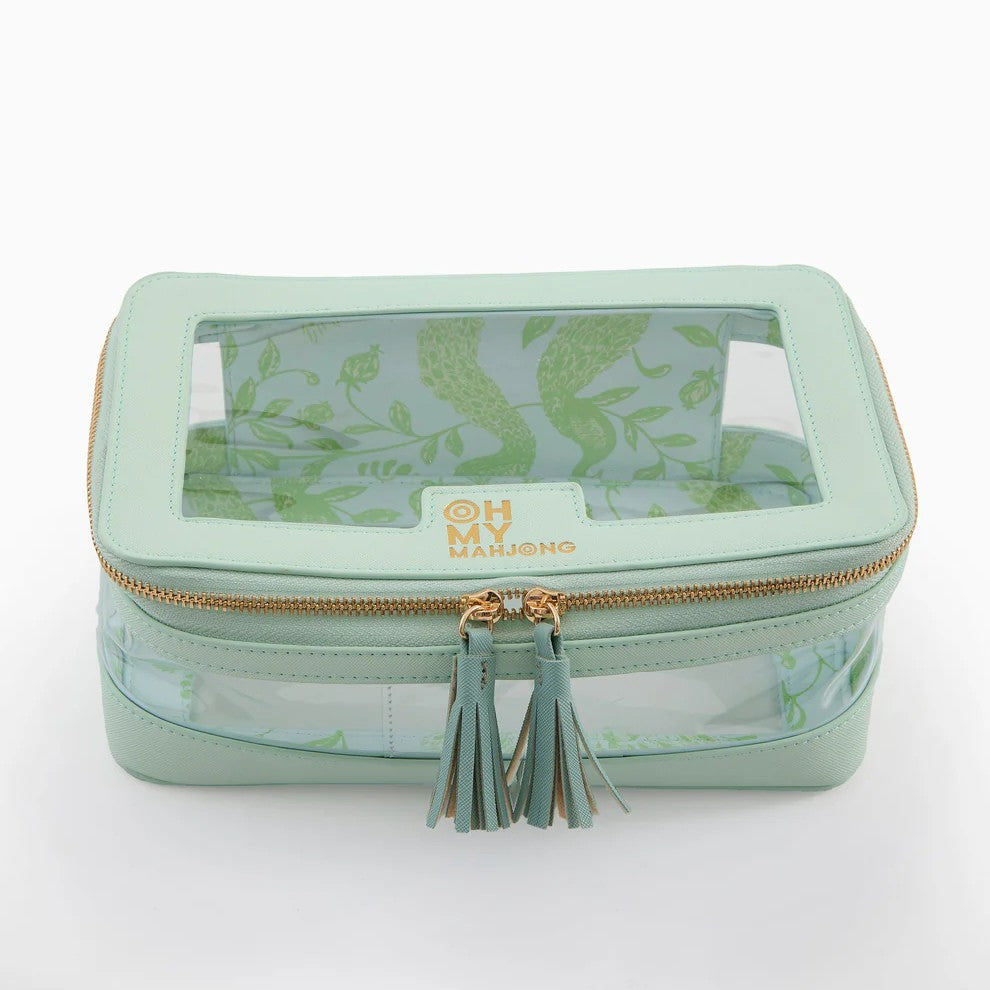 Keep your mahjong tiles organized in style with this thoughtfully designed storage bag. The structured silhouette maintains its shape for easy stacking and storage, while a zip-around closure keeps tiles secure. A clear panel lets you view your collection at a glance, and the built-in label window helps you identify sets instantly—perfect for collectors with multiple bags. Inside, a patterned lining adds personality, while coordinating tassel zipper pulls and a back handle make transport effortless. Fresh, 