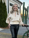 Look and feel your best with this must-have chic champagne colored top! Crafted from luxurious shimmery fabric, it features a mock neck and peekaboo hole in the neckline, billowy sleeves, and a button closure neckline. The smocked waistband with tie adds sculpting and dimension and makes it perfect for the holiday season or a special dressy occasion.  Material: 60% Rayon / 40% Polyester  Care Instructions: Hand wash cold