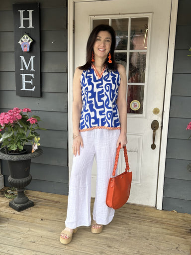 <p>You will love&nbsp;our Modern Print V-Neck Top! This top is not only cute and fun, but also perfect for the spring season. With its modern design, it adds a touch of style to any outfit. The bold royal blue and white colors, along with the orange and white trim, make it a standout piece!</p> <p>Material: 85%&nbsp;Rayon / 15%&nbsp;Nylon</p> <p>Care Instructions: Gentle cool hand wash, dry flat in shade</p>