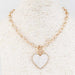 This stunning gold chain necklace showcases a pearlized heart pendant that radiates timeless romance and refined style. Whether you're celebrating Valentine's Day or adding a touch of elegance to your everyday wardrobe, this classic piece delivers effortless sophistication. The lustrous heart catches light beautifully, creating a subtle shimmer that complements any outfit.

Length: 16-18"