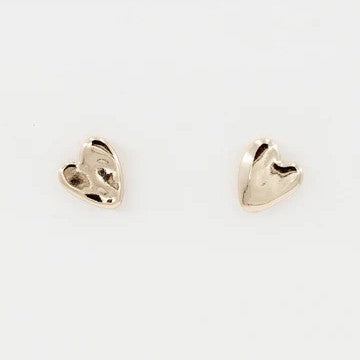 Capture hearts with these charming Hammered Heart Stud Earrings, the perfect Valentine's Day gift. Crafted in lustrous gold with a textured hammered finish, these delicate studs add romantic elegance to any look.&nbsp;

Size: .5"