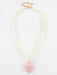 Celebrate love and natural beauty with this charming beaded stone necklace featuring a delicate pink heart pendant. Crafted with smooth white stone beads that complement the warm rose tones of the heart, this versatile piece transitions effortlessly from Valentine's Day romance to spring celebrations and beyond.&nbsp;

Length: 16-18"
