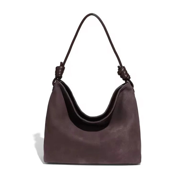 The Chatham Vegan Suede Hobo Bag combines ethical style with everyday practicality. Luxuriously crafted from vegan suede, this versatile bag features a striking knot-tied handle that makes a statement. Inside, you'll discover thoughtful organization with a zip pocket for valuables and a slip pocket for quick access items. The secure magnetic closure keeps everything protected while you navigate your day. Perfect for anyone who refuses to compromise between conscience and sophistication.

Dimensions:

14" (W