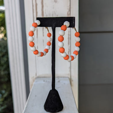 Show off your team spirit with our Game Day Hoop Earrings! Perfect for any collegiate event, these fun earrings are a must-have for any fan. Let these earrings be a representation of your love and support for your team. Join in on the fun and show your true colors with our Game Day Hoop Earrings!