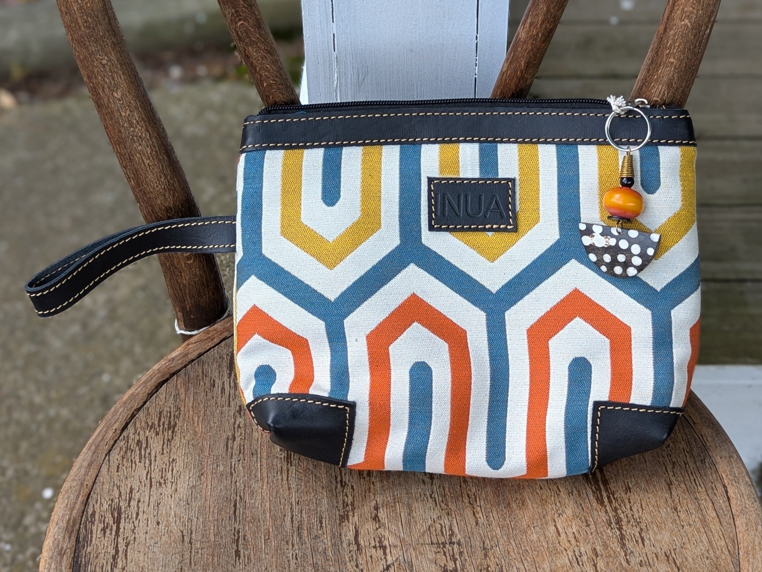 Make a difference with our Wristlet/Cosmetic Bag - Crafted with Purpose. This versatile bag offers a wristlet handle, a durable upholstery material, and an open inside pocket for added convenience. Don't forget the adorable keychain charm, adding a touch of cuteness to your daily essentials.

This bag is made by talented artisans in Kenya using upcycled upholstery fabric. Every purchase provides opportunities, empowers communities and creates sustainable livelihoods.

Carry more than a bag - carry hope.