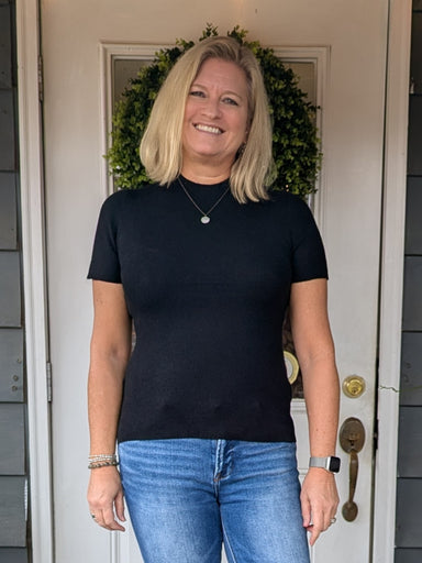 The perfect wardrobe essential, this soft knit sweater top delivers effortless style in a timeless black hue. Designed for versatility, its lightweight construction makes it ideal for layering under jackets or wearing solo. The simple silhouette flatters any frame while remaining comfortable enough for all-day wear. Whether you're building a capsule wardrobe or refreshing your everyday basics, this staple piece transitions seamlessly from casual to polished looks.

Material: 30% Polyester / 24% Acrylic / 20