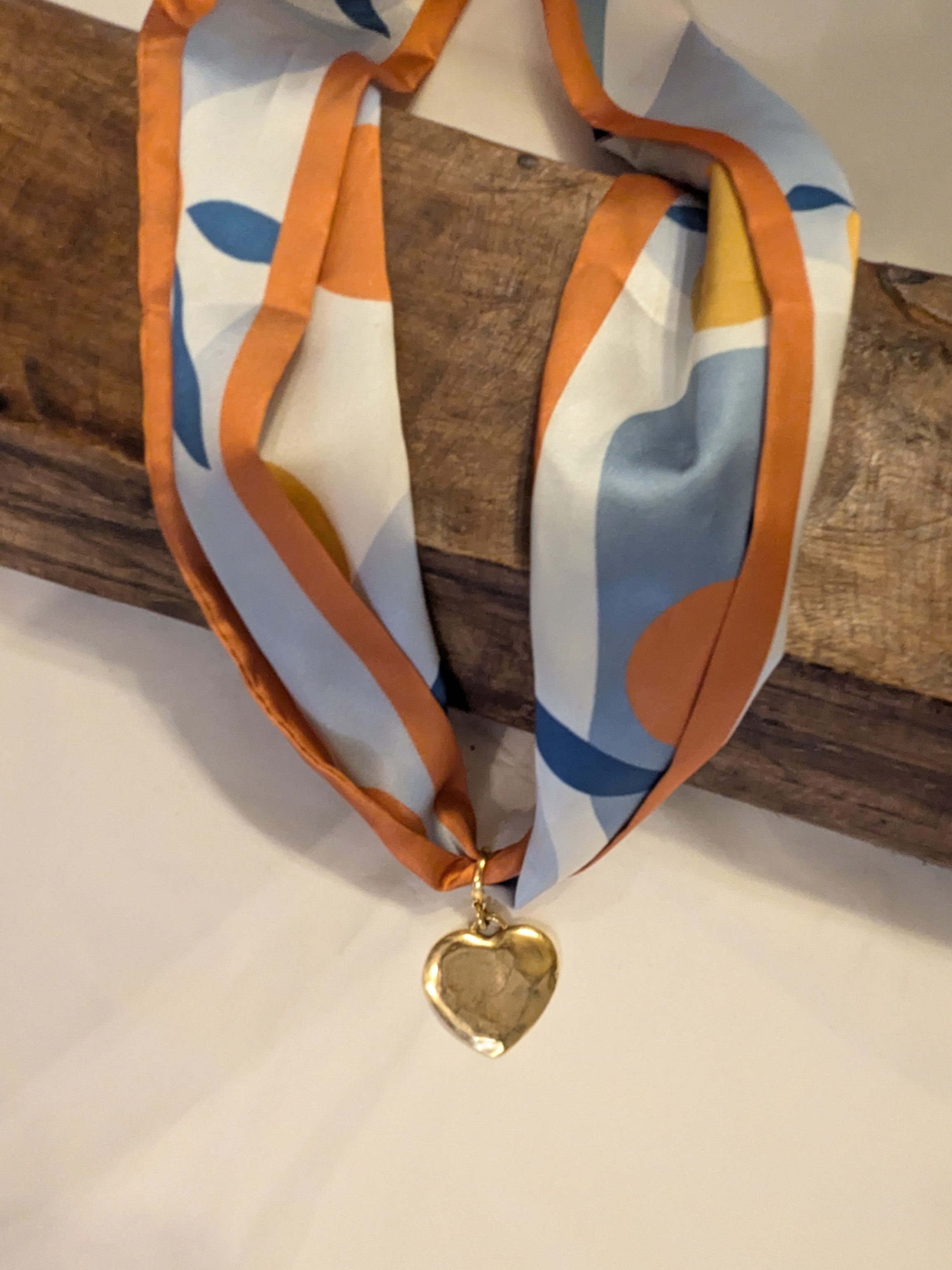 We love our new scarf necklaces. Change yours up with our Hammered Necklace Charms. These combine fun and class in one versatile accessory. Perfect for dressing up any look with a unique, fashionable flair.

You can also wear them on your favorite necklace chain. So versatile!

Scarves sold separately.