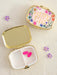 Keep your daily medications organized and accessible with this charming "Happy Pills" pill box holder. The compact design fits easily into purses, travel bags, or bathroom drawers, making it perfect for on-the-go lifestyles. An internal divider creates two separate compartments, allowing you to sort different medications or supplements with ease. The cute, thoughtful design transforms a practical necessity into something you'll actually enjoy using every day.

Dimensions: 2.25in L x 2in W x 1.25in H

Materi
