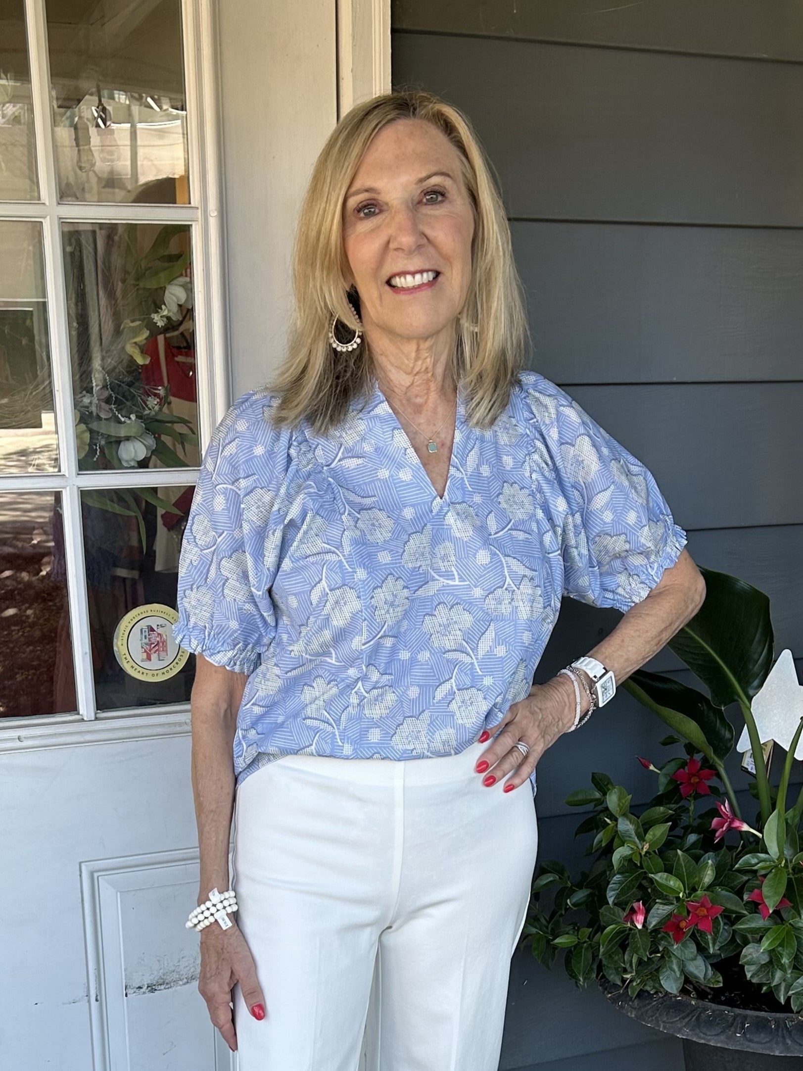 Add a touch of subtle blue to your spring/summer wardrobe with our beautiful Puff Sleeve Flower Print Top! Featuring a flattering V-neck, ruffled collar, and puffed sleeves with elastic band, this top is perfect for any occasion. Pair it with your favorite white shorts, skirt or pants for a stylish and effortless look.  Material: 100% Polyester  Care Instructions: Gentle cool hand wash, dry flat