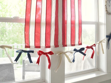 Drape your space in patriotic pride with this stunning Red, White &amp; Blue Felt Bow Garland. Each carefully crafted bow bursts with festive charm, perfect for Independence Day, Memorial Day, or year-round celebration of American spirit. The rich felt construction ensures lasting quality and vibrant color that won't fade. String it across mantels, doorways, or walls to instantly transform any room into a patriotic showcase.&nbsp;