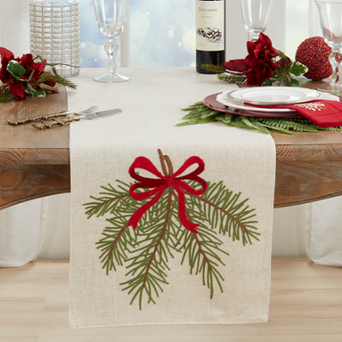 This beautiful table runner sets a lovely tone for your holiday table or buffet. There are so many creative ways to use it! It has a natural background, is 70 inches long, with the embroidered pine needle and bow covering 8 inches on each end.&nbsp;

Let us know if you have questions.&nbsp;

Dimensions: 16: x 70"

Material: 84% Polyester / 16% Linen

Care Instructions: Machine wash cold delicate cycle, do not bleach, hang dry