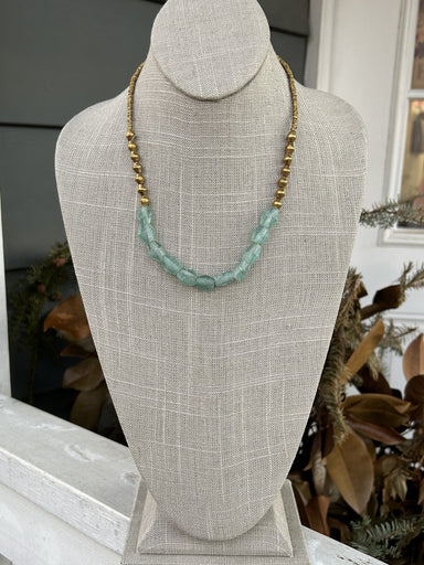 Transform any outfit with this Sea Glass Beaded Brass Necklace! The adjustable design allows for a perfect fit, while the brass beads and sea glass accent add a unique Boho look. Chic and versatile, this necklace is a must-have!