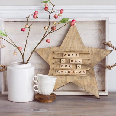 Announce your special moments with this charming star scramble board featuring a complete set of wooden tile letters. The rich stain finish adds warmth and sophistication to any room while the distinctive star shape makes it an eye-catching display piece. Whether you're celebrating the Fourth of July, Christmas, or simply brightening your everyday décor, this versatile board lets you customize your message instantly. Perfect for welcoming guests, sharing inspirational quotes, or marking memorable occasions—
