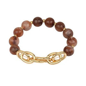 Discover the perfect balance of color and shine with this eye-catching stretch bracelet. Lustrous colored beads pair beautifully with a gold chain accent, creating a sophisticated mixed-media design that stands out. The elastic band stretches to fit comfortably, making it ideal for everyday wear or special occasions. Stack it with complementary pieces or let it shine on its own.