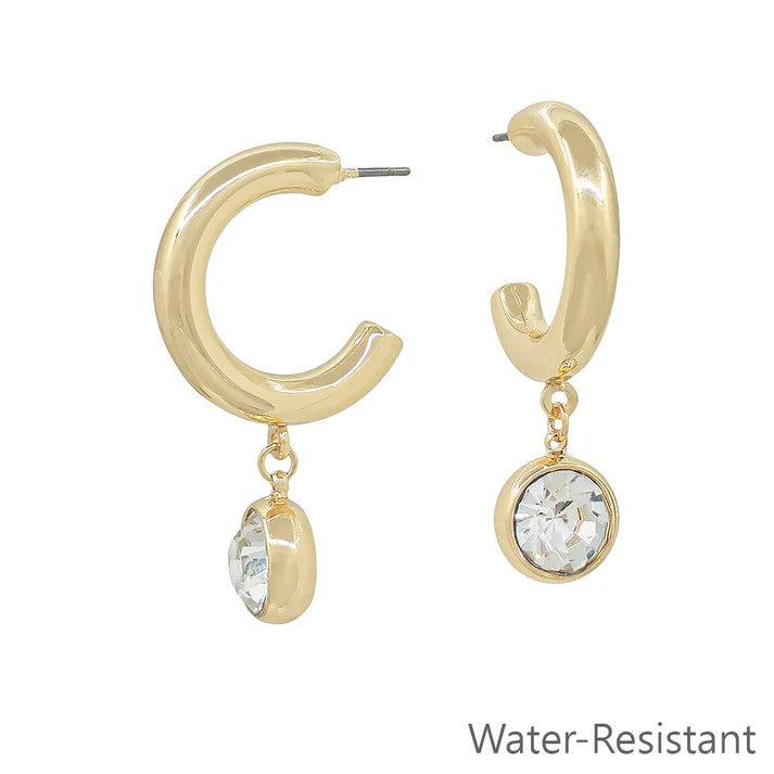 These elegant hoop earrings with a circle crystal drop offer a beautiful sheen that enhances your natural grace. Their refined design brings a classy touch to any ensemble, making them the perfect accessory for both everyday wear and special occasions.&nbsp;

Length 1.5"