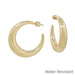Discover the perfect foundation for your jewelry wardrobe with these elegant gold rounded hoop earrings. Built with water-resistant technology, they withstand moisture and daily wear while maintaining their brilliant shine. The reliable post-back design offers secure, comfortable wear from morning to night. These versatile hoops work with any outfit and occasion, making them the indispensable staple every collection deserves.

Size: 2" Hoop