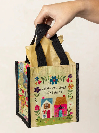 Celebrate friendships with this charming Small Happy Bag, the perfect gift for the friends who make life better. Crafted from durable recycled water bottles, these eco-conscious bags are built to last through years of use and love. Whether you're stocking your gift closet or treating someone special, this versatile tote combines sustainability with style—because the best gifts reflect both thoughtfulness and quality.

Measurements: 5.5in L x 5in W x 6in H, 4 in handle drop

Material:&nbsp;RPET, made with 80