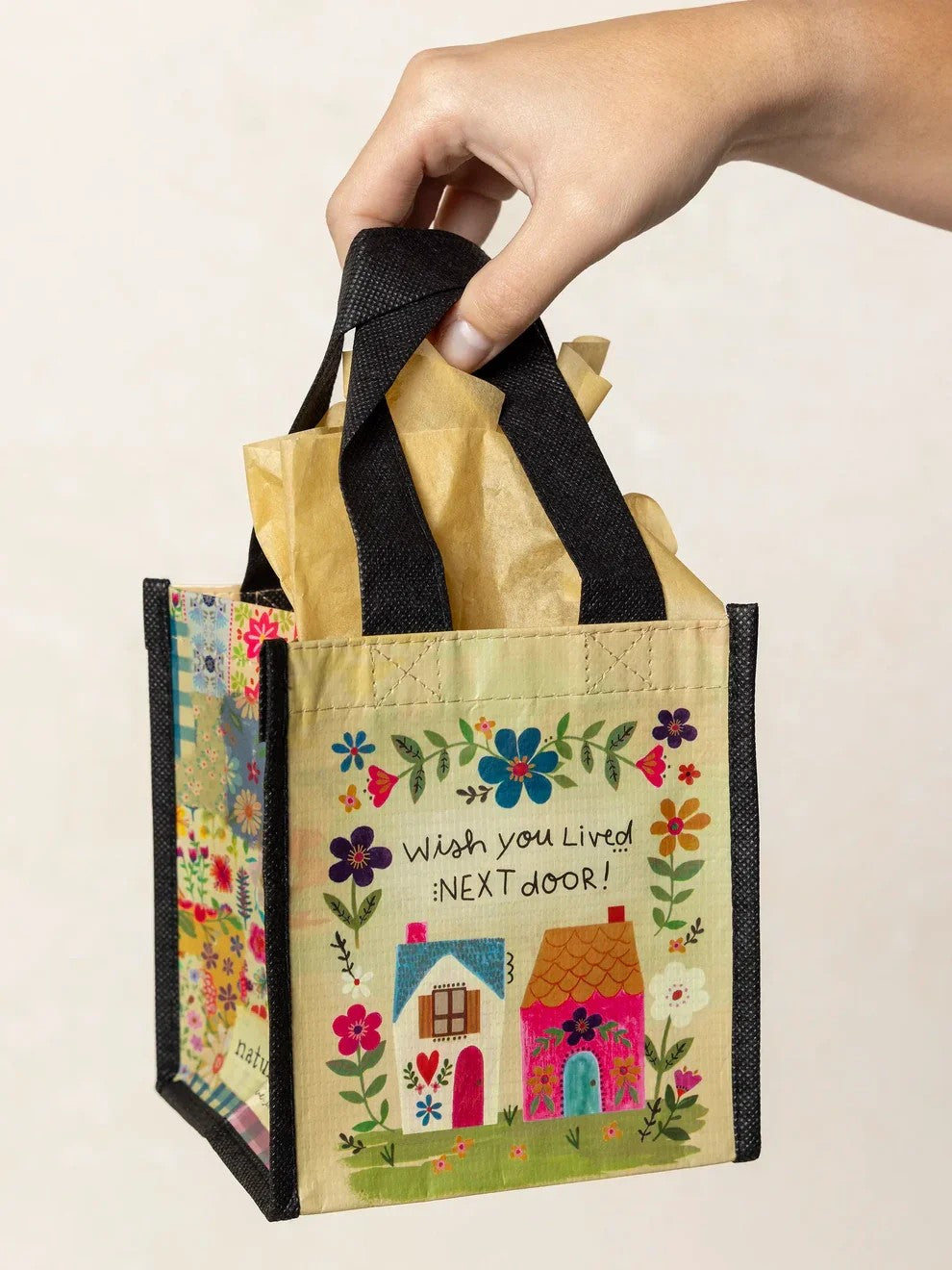 Celebrate friendships with this charming Small Happy Bag, the perfect gift for the friends who make life better. Crafted from durable recycled water bottles, these eco-conscious bags are built to last through years of use and love. Whether you're stocking your gift closet or treating someone special, this versatile tote combines sustainability with style—because the best gifts reflect both thoughtfulness and quality.

Measurements: 5.5in L x 5in W x 6in H, 4 in handle drop

Material:&nbsp;RPET, made with 80