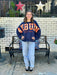 Nothing shows your love for your team like this amazing oversized dolman sleeve fleece crewneck with extra large plaid fabric appliqué outlined with embroidery! It is so cute, so cozy and so bold! It features a small team logo at the left sleeve cuff.

If we don't have your college, ask if we can get it!&nbsp;

Fabrication: 100% Cotton Fleece
