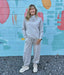 Experience ultimate comfort with this Heather Gray Cowl Neck Sweatshirt. Crafted from irresistibly soft material, it’s perfect for cozy days. The adjustable drawstring bottom allows you to cinch the fit for added warmth and style. Whether lounging or out and about, this sweatshirt combines casual ease with a flattering silhouette you'll love.

Pair with our matching "Jogger Pants".

Paula is wearing a size Medium.

Material: 48% Modal / 48% Polyester / 4% Spandex

Care Instructions: Hand wash separately in 