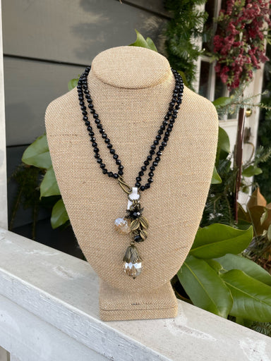 One of our best selling necklaces! Handmade, crystal beads with antiqued gold charms, including a flower, large crystal, leaves, and is available with or without the Blessed Bar charm (see details below). It can be worn short, as a 22 inch double strand, or long (40 inches). It's 2 necklaces in one and looks great both ways! You're sure to enjoy wearing it and enjoy all the compliments you receive even more. 
