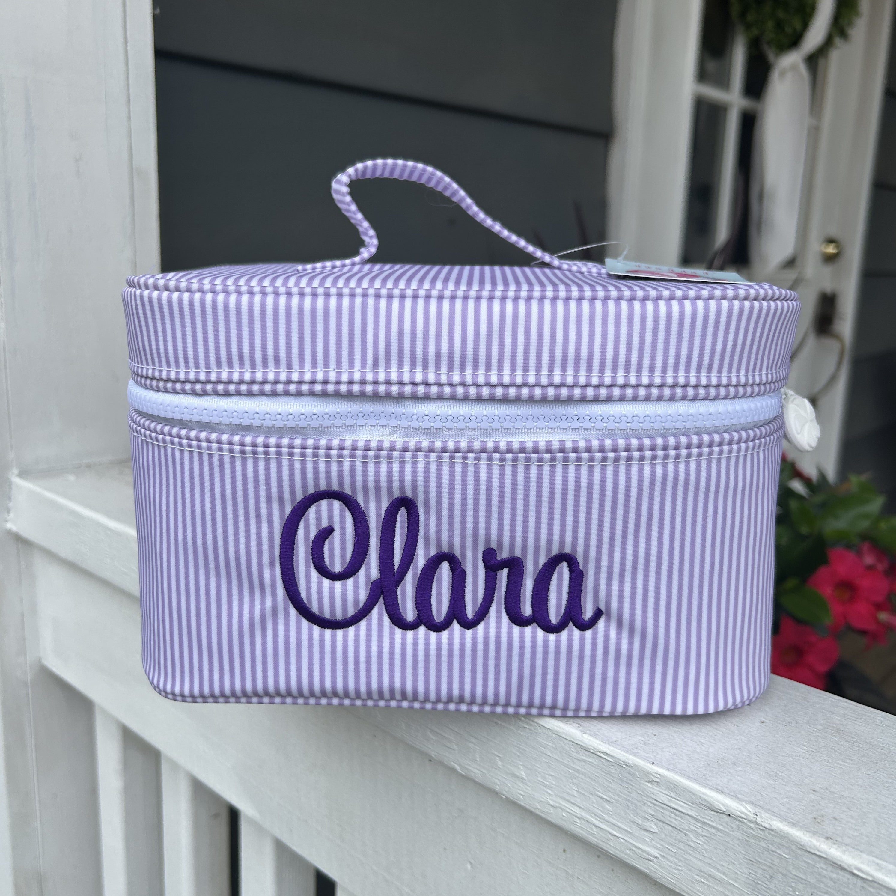 You will love our new Wipeable Train Cases—the ultimate cosmetic organizer designed for sorority sisters, team enthusiasts, and anyone who values style and practicality. Featuring a fully wipeable surface for effortless cleaning, these cases open almost completely flat, making for easy access and monogramming. Choose from an array of sorority and team colors to match your pride. Built with premium zippers and charming peppermint pulls, each case includes a convenient top handle for easy transport. The washa