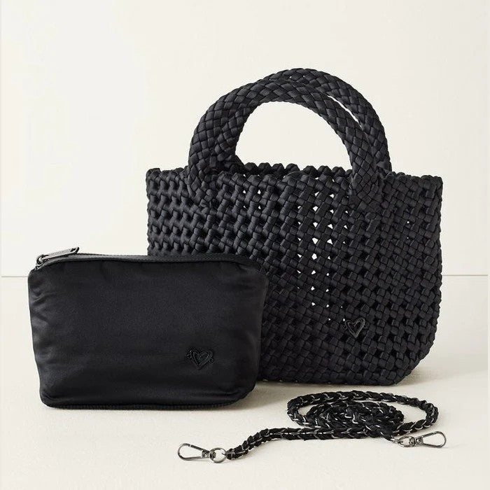 The Cambridge Small Hand-knotted Tote combines timeless style with everyday practicality. Meticulously hand-knotted with a distinctive woven texture, this versatile bag transitions seamlessly from tote to crossbody thanks to its removable chain strap. Sturdy handles ensure durability, while the compact size makes it the perfect go-anywhere companion. An included removable zippered pouch keeps your valuables secure. Understated elegance meets functionality in a piece designed to complement any wardrobe and l