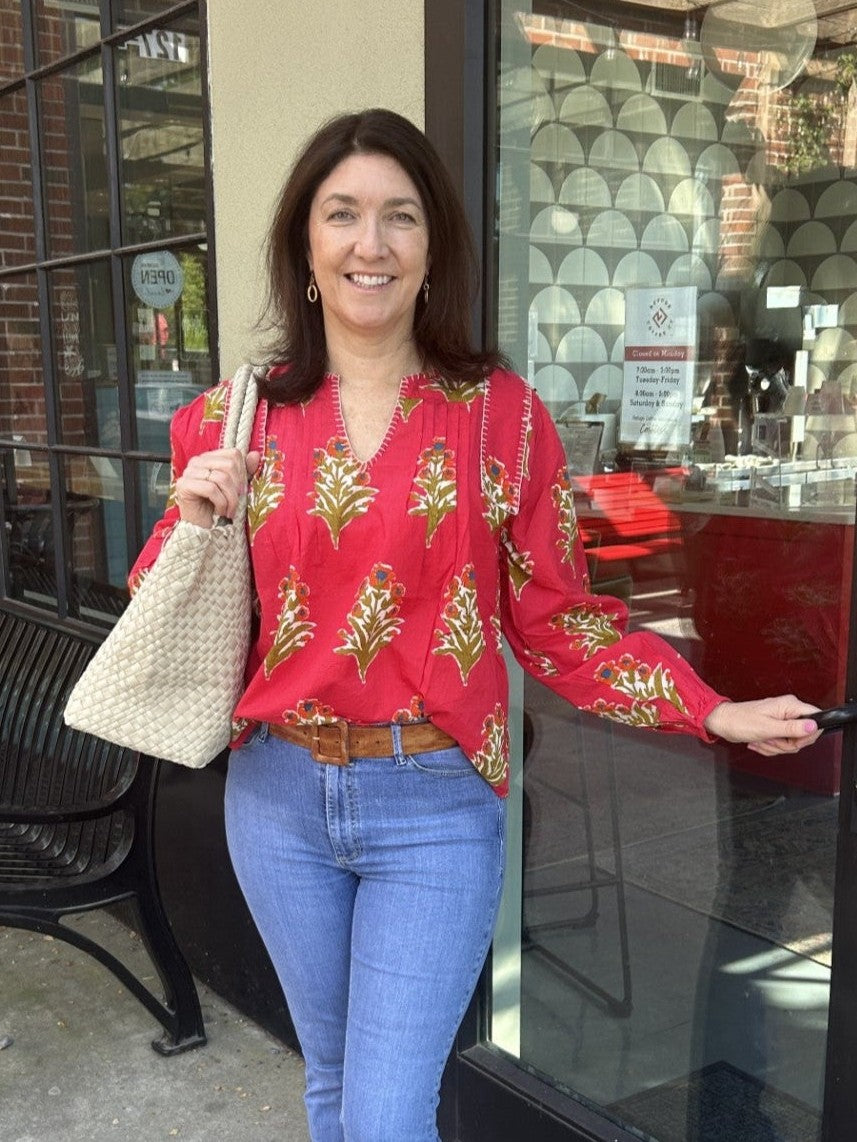 This long sleeve floral V-neck top by THML features detailed neck stitching and a vibrant red background adorned with an elegant floral design. The pleated front adds a sophisticated touch, creating a stunning combination of textures and patterns.

Tara is wearing a medium and paired it with Risen jeans and our Preenlove bag.

Material: 100% Cotton

Care Instructions: Gentle cool hand wash, dry flat