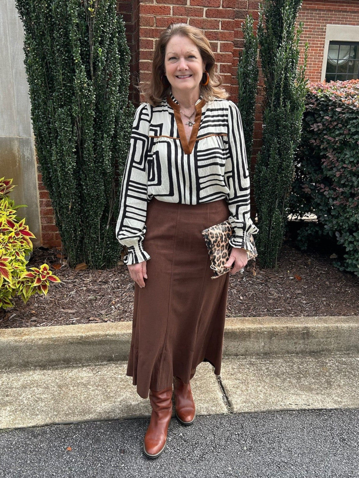 This Long Faux Suede Skirt in a warm chocolate brown features elegant front detailed stitching and a subtle flare that flatters every silhouette. Crafted with a soft suede feel, it ensures comfort throughout the day. A discreet side zipper offers easy wear, making it perfect to pair with your favorite boots or heels for a chic, versatile look.

Material: 93% Polyester / 7% Spandex

Care Instructions: Hand wash cold inside out, line dry