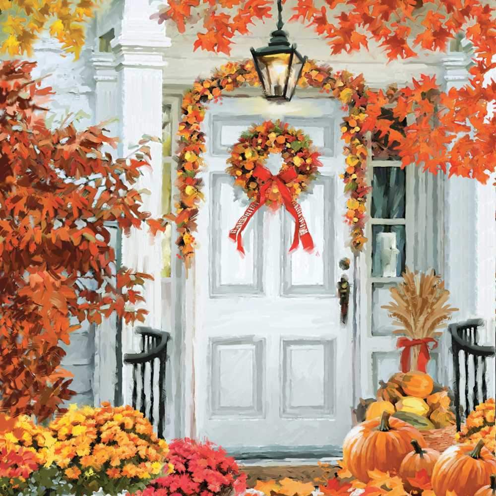 Scene of a white front door featuring a wreath and garland made of fall leaves in yellows, oranges and browns. Pumpkins and mums are decoratively placed on the porch. 