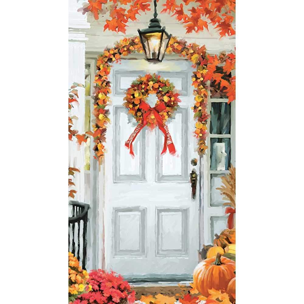 Scene of a festive fall front door with orange and yellow wreath and garland. Pumpkins and mums in the foreground. 