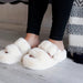 These are the softest slippers! They are in a beautiful cream color with a buckle accent. The bottom of these slippers are sturdy so that you can step outside in them. These are great indoor and outdoor slippers!